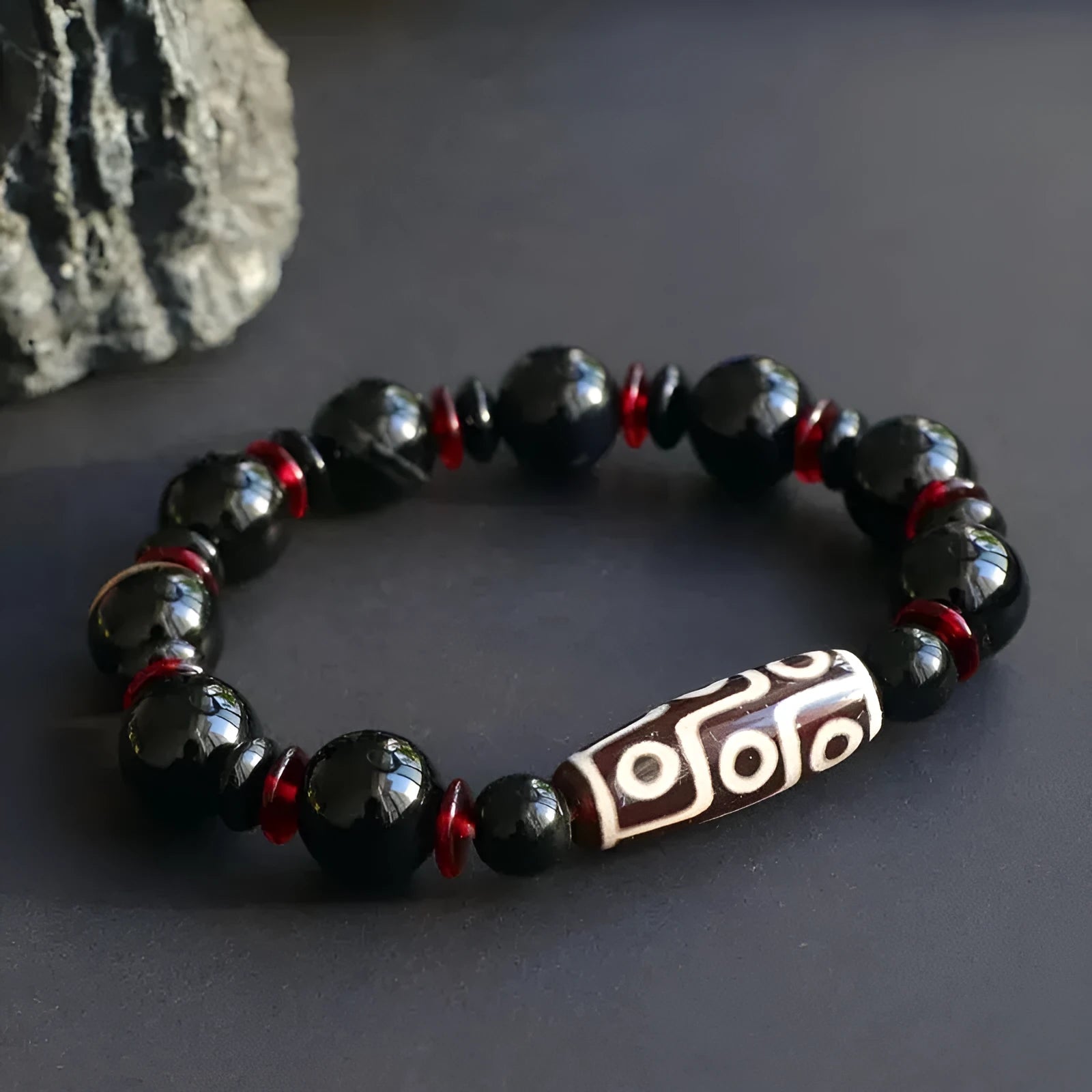 Black agate dzi bead bracelet with chalcedony stones and hand-woven design