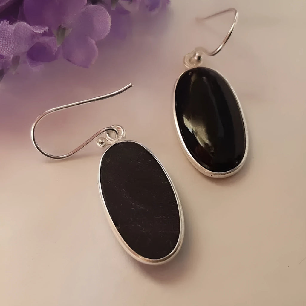 Women's oval black agate pendant earrings with geometric Chinese design on silver-style alloy