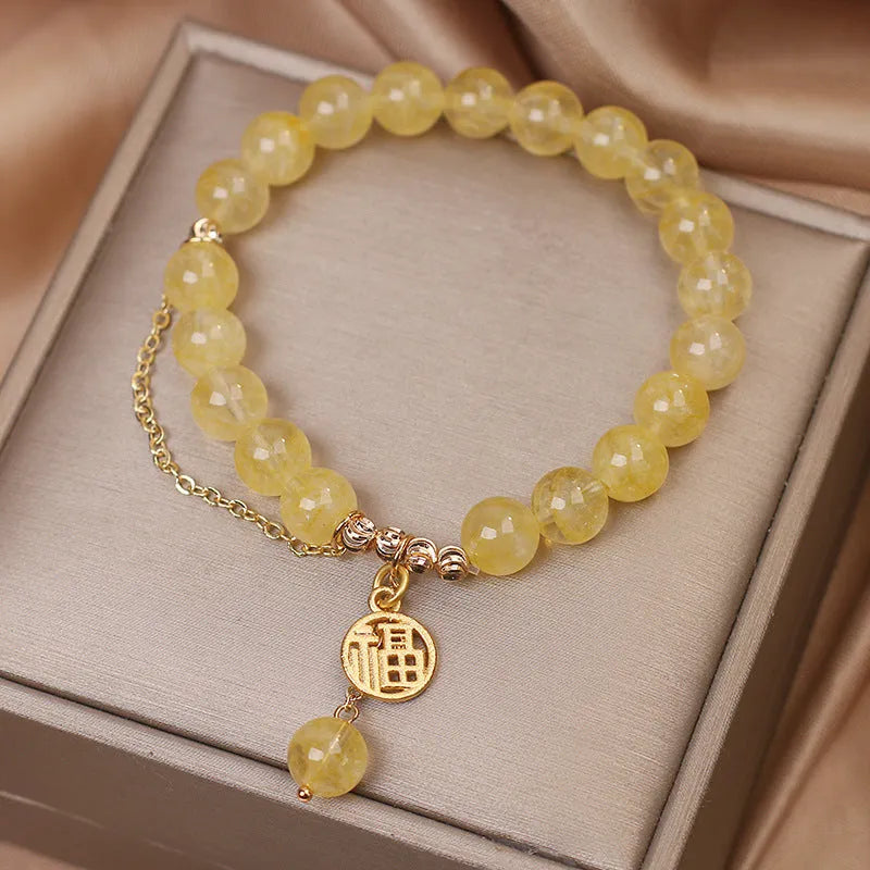Adjustable natural citrine gemstone bracelet with selectable Chinese 'Cai' or 'Fu' character charm and tassel.