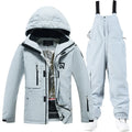 Men's and women's winter ski suit in blue top and black pants, waterproof and windproof for snow sports