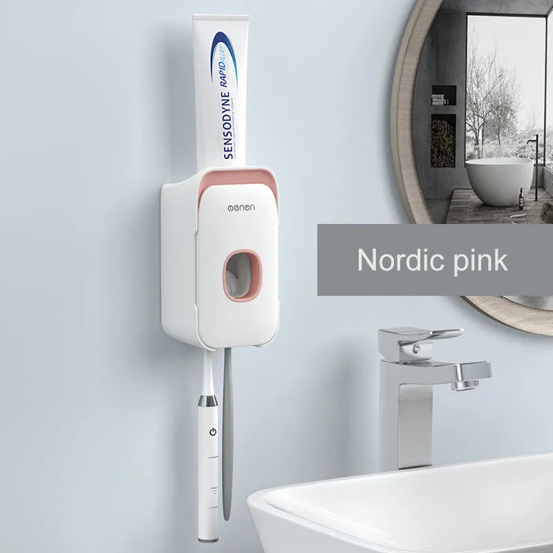 Blue automatic toothpaste dispenser mounted on bathroom wall with one-touch dispensing mechanism