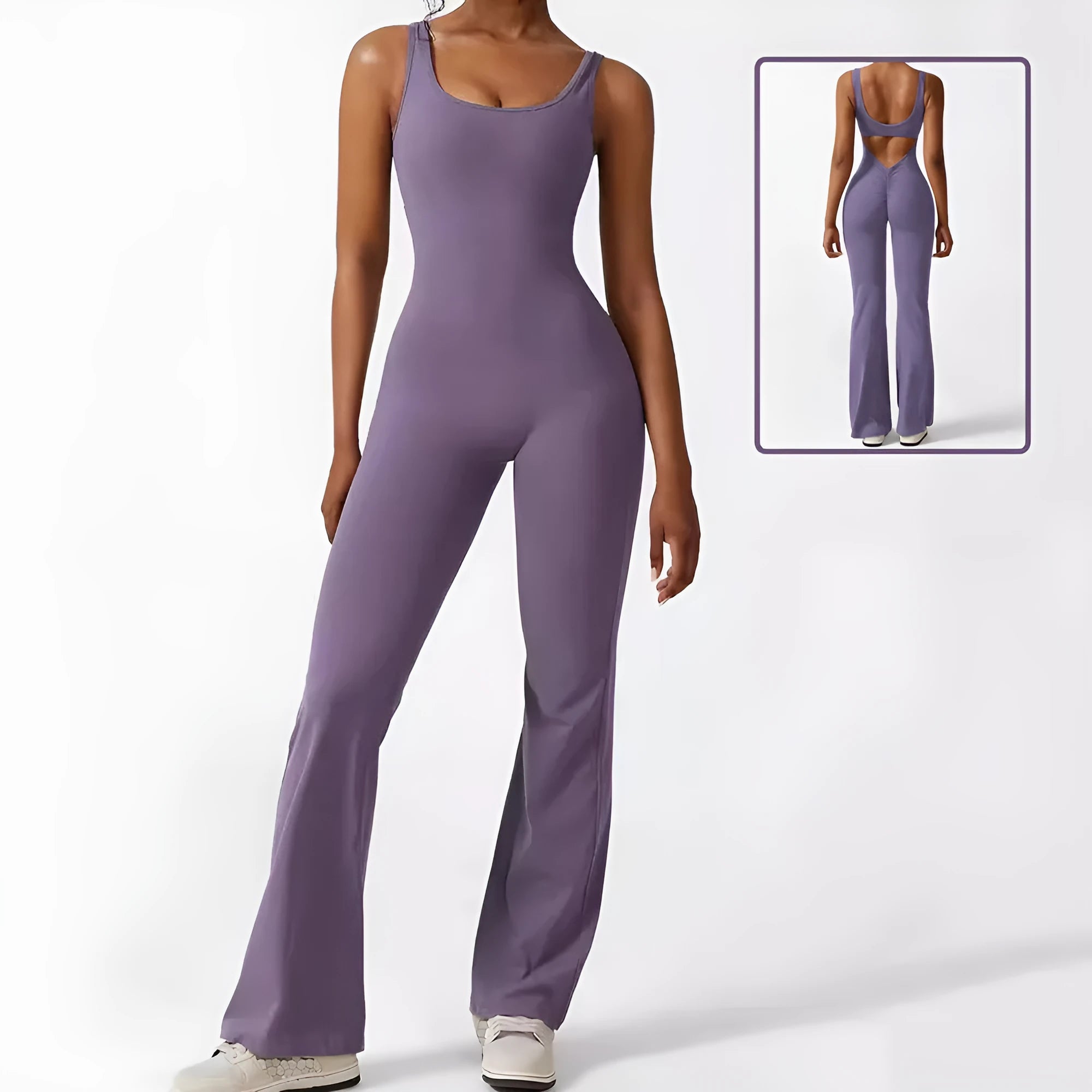 Woman wearing a sleeveless army green flare-leg jumpsuit for yoga or casual wear.