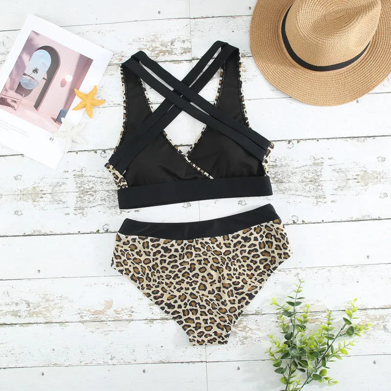 Women's leopard print bikini swimsuit with V-neck front and side split design on a mannequin.
