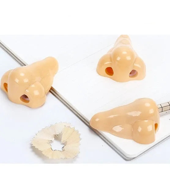 Flesh colour plastic pencil sharpener with geometry shape measuring 58×45×30mm for student stationery