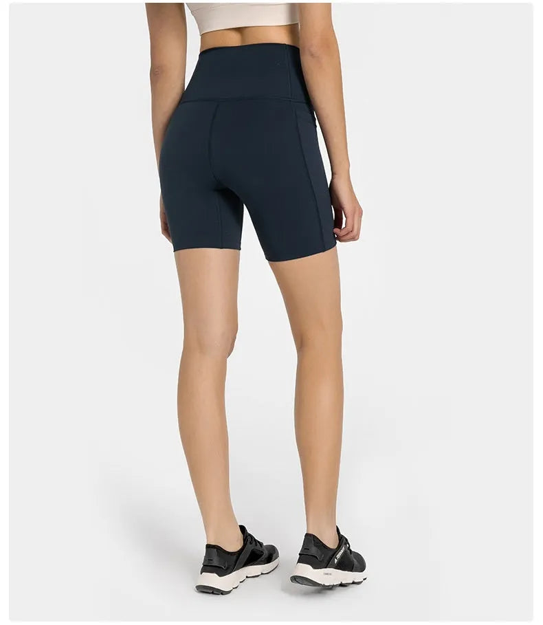 Women's black sport shorts with super stretch fabric and mid-thigh length.
