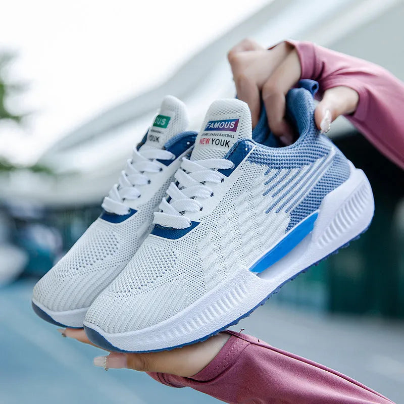 Men's blue casual sports shoes with breathable mesh cloth upper and round toe on a plain background.