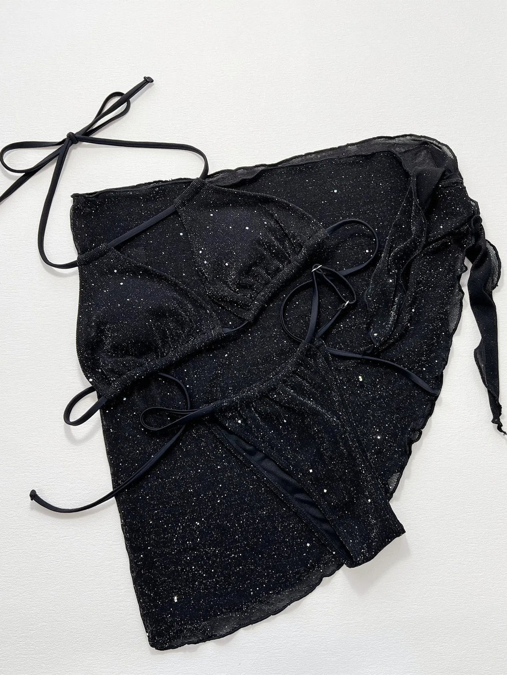 Black three-piece polyester bikini set with top and shorts on a size chart showing S, M, L.