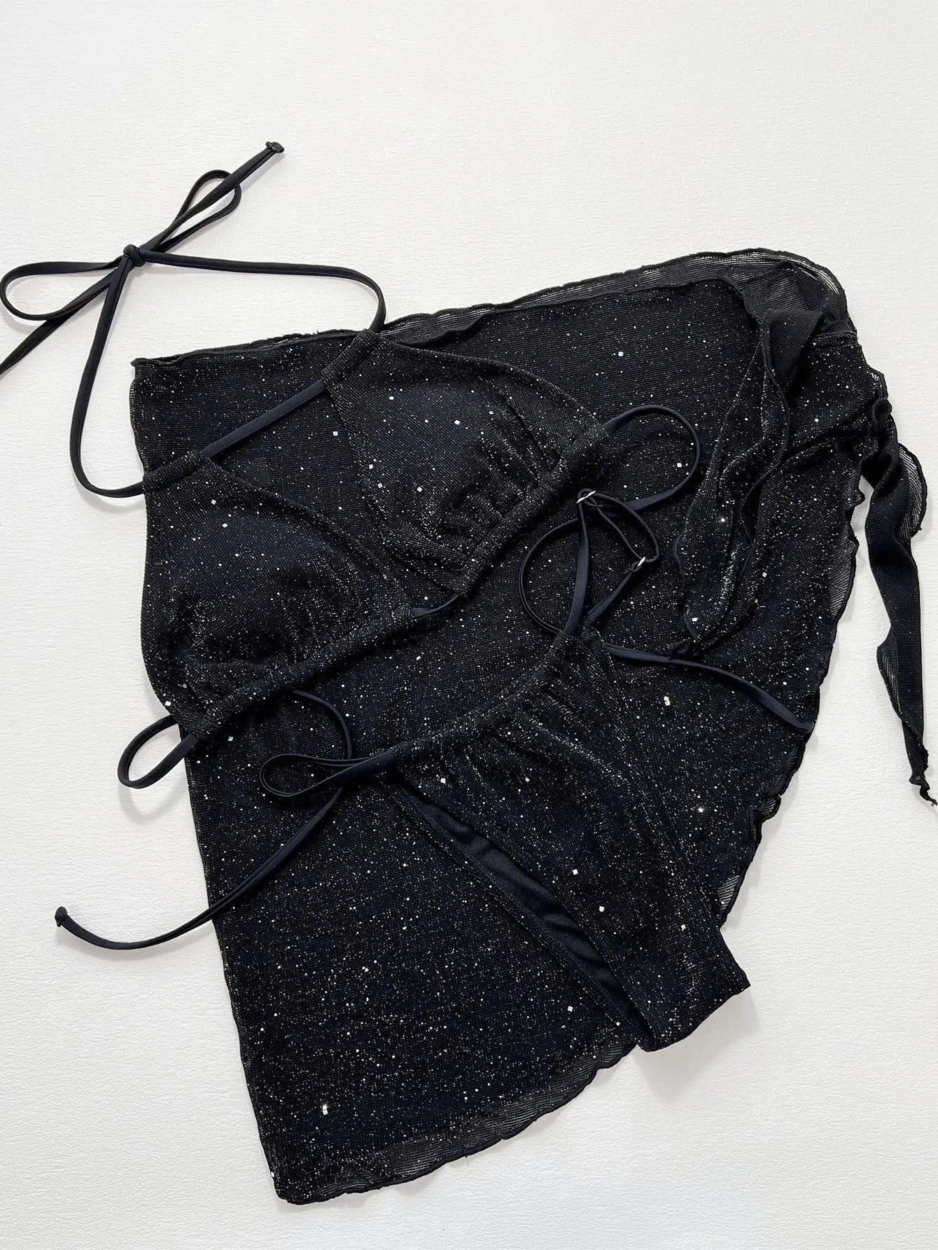 Black three-piece polyester bikini set with top and shorts on a size chart showing S, M, L.