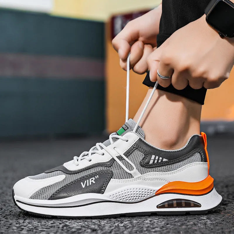 Men's grey breathable mesh casual shoes with a round toe and middle-top height on a white background.