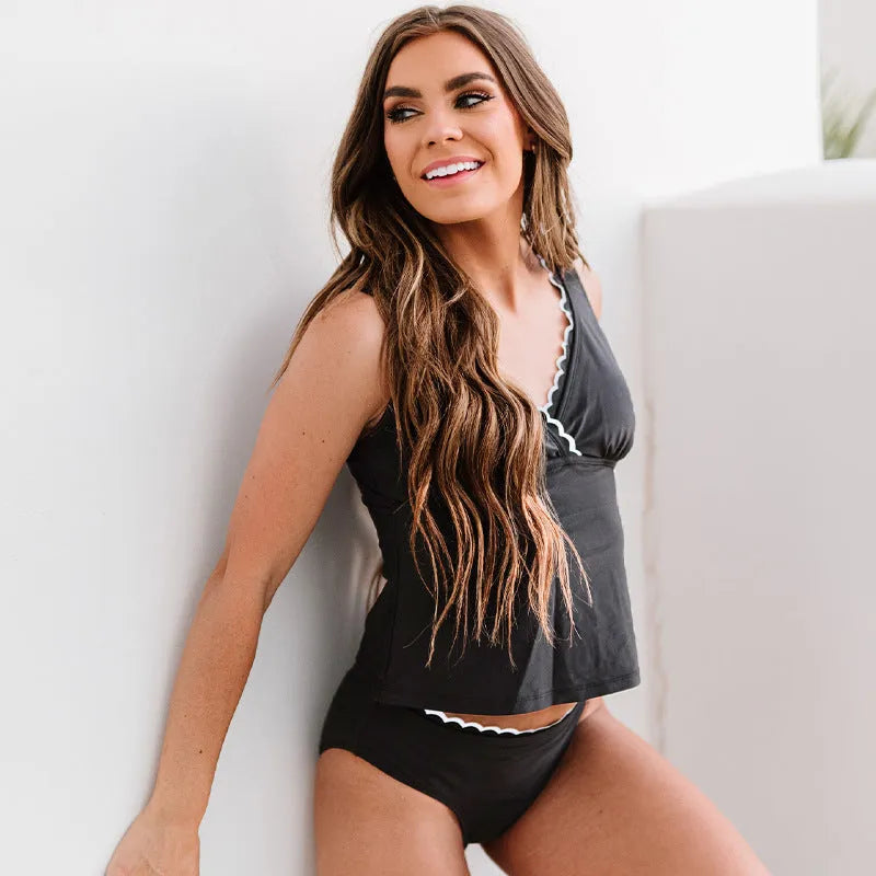 Black women's nylon bikini swimsuit set with sleeveless design on size chart