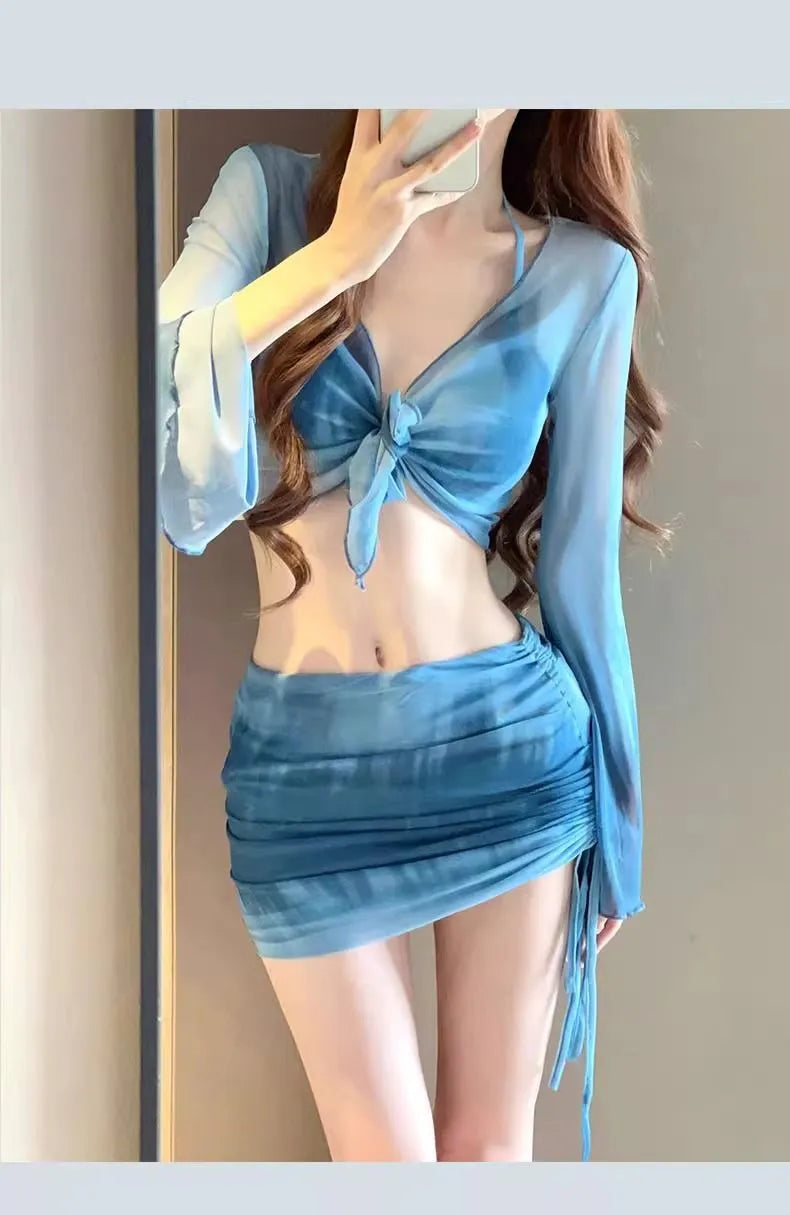 Women's blue high waist bikini four-piece swimsuit set with shirt, bra, underwear and skirt components