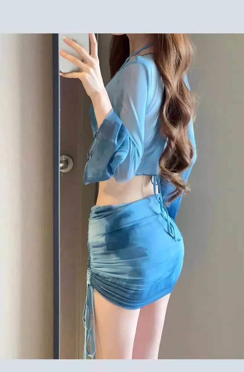 Women's blue high waist bikini four-piece swimsuit set with shirt, bra, underwear and skirt components