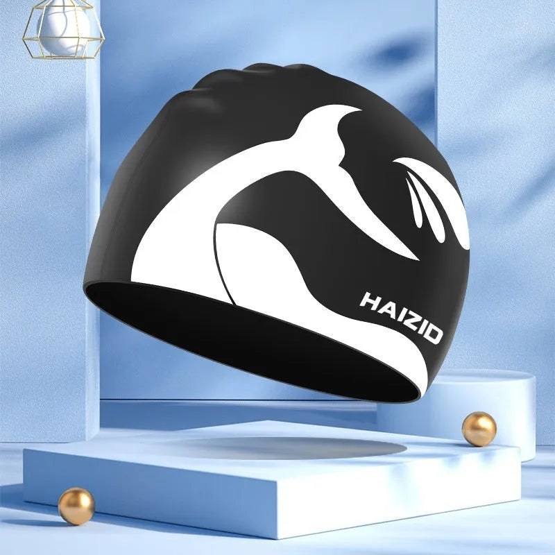 Silicone swim cap with whale tail pattern and waterproof ear protectors in multiple colour options