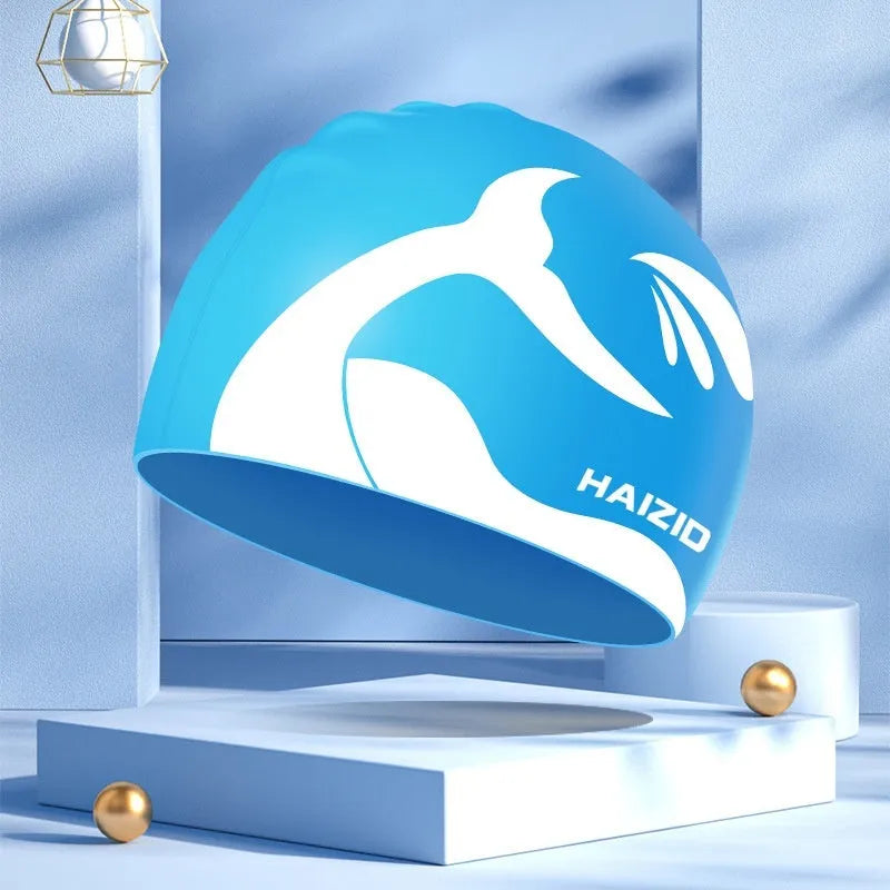 Silicone swim cap with whale tail pattern and waterproof ear protectors in multiple colour options