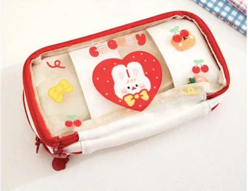 Transparent TPU pencil case with Korean-style pink rabbit design showing visible pens inside