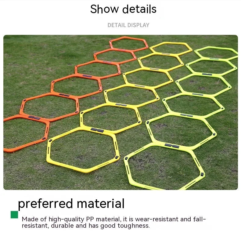 Six foldable hexagon agility training rings in green, orange, and yellow colours laid out on grass.