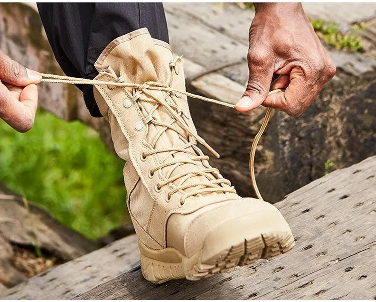 Yulong tactical desert combat boots in black and sand colour on a rocky outdoor terrain.