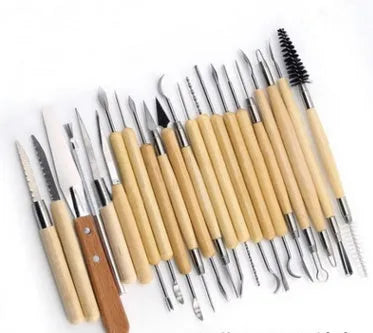 27-piece brown pottery clay tool set with stainless steel tools in a storage roll
