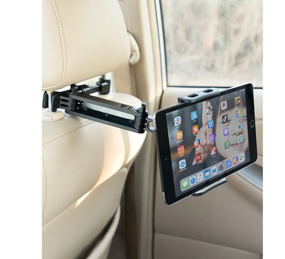 Black universal car phone holder attached to vehicle rear seat base with tablet mounted