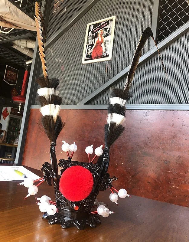 Zijin Crown black motorcycle helmet decoration with purple-gold accents and a long feather plume.