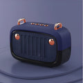 A compact portable Bluetooth mini speaker in one of five colours: black, blue, green, grey, or orange.