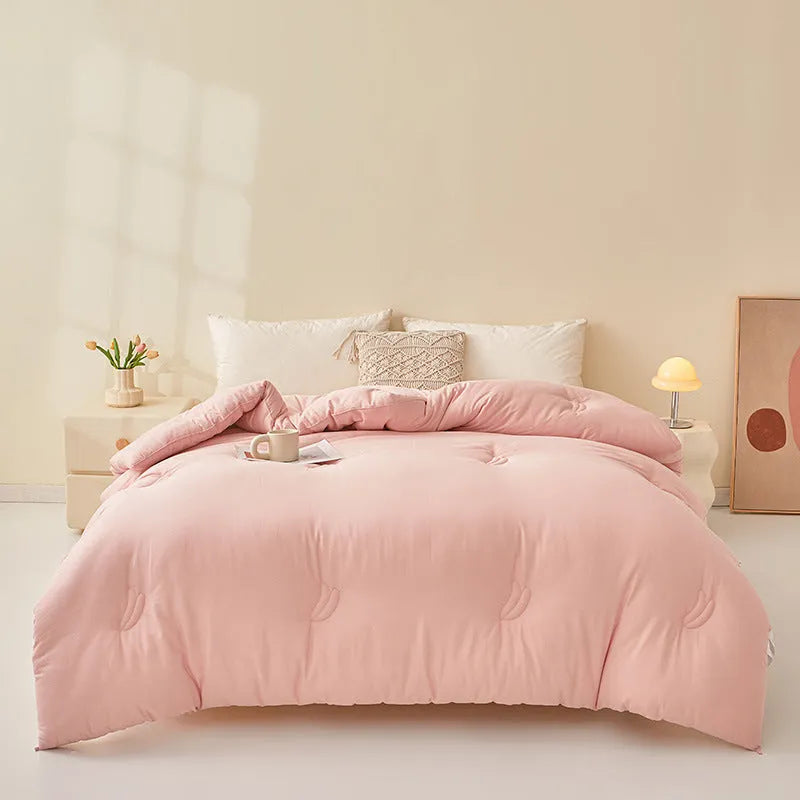 Soybean fibre pure cotton quilt shown in grey, pink jade or white colour on a bed.