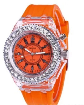Women's LED luminous watch with round alloy case and colourful silicone strap.
