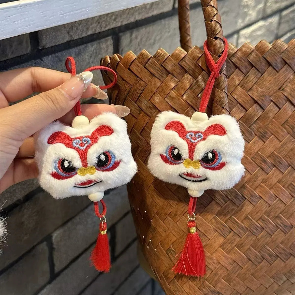 Blue Chinese style plush lion keychain ornament with tassels and star stone detail