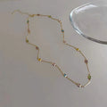 Square geometric artificial crystal pendant on clavicle-length alloy chain necklace in gold tone