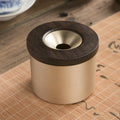 Retro brass ashtray with solid copper construction and hinged wooden lid featuring central circular aperture