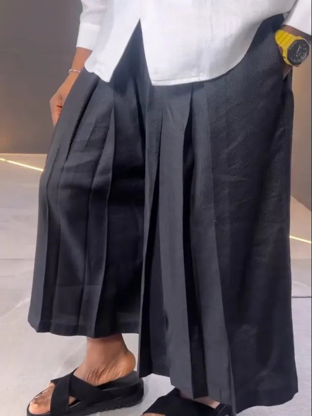 White asymmetric-front long sleeve shirt with black pleated trousers casual set