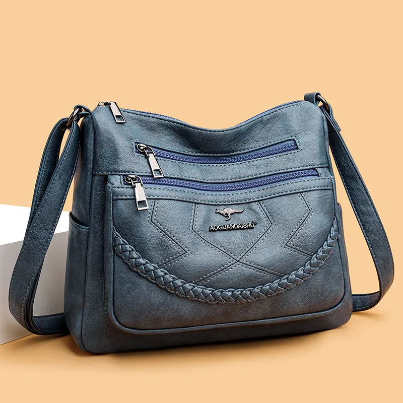 Soft PU leather women's shoulder bag with crossbody strap in black colour