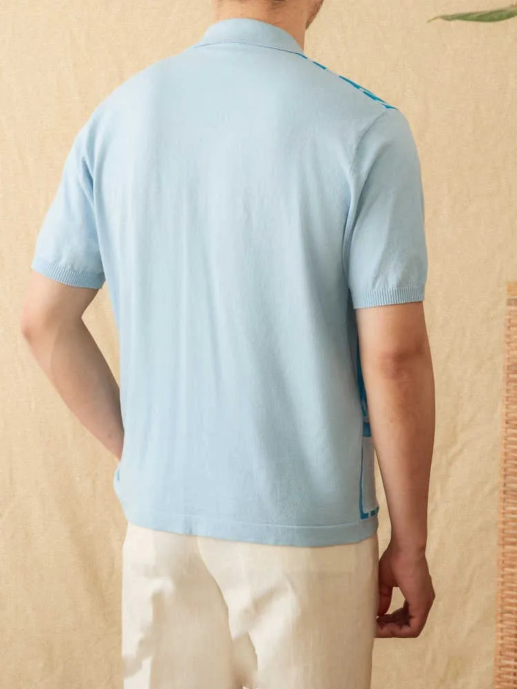 Man wearing a royal blue striped short sleeve polo shirt with a lapel collar.
