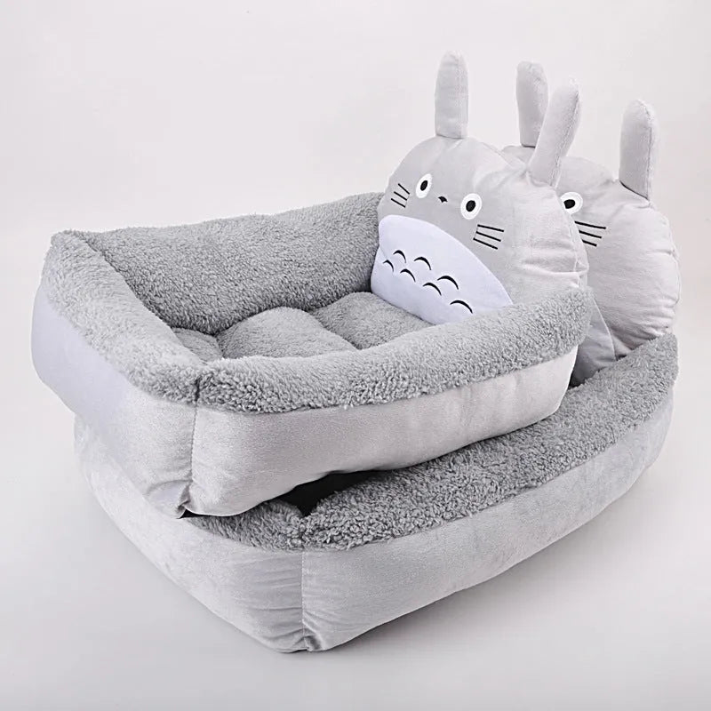 Cartoon-style washable pet bed for small dogs and cats in plush fabric with raised sides