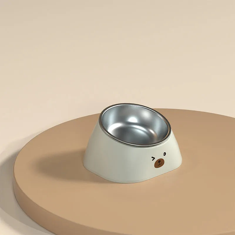 Green tilted pet feeding bowl with stainless steel insert and plastic base for cats and dogs.