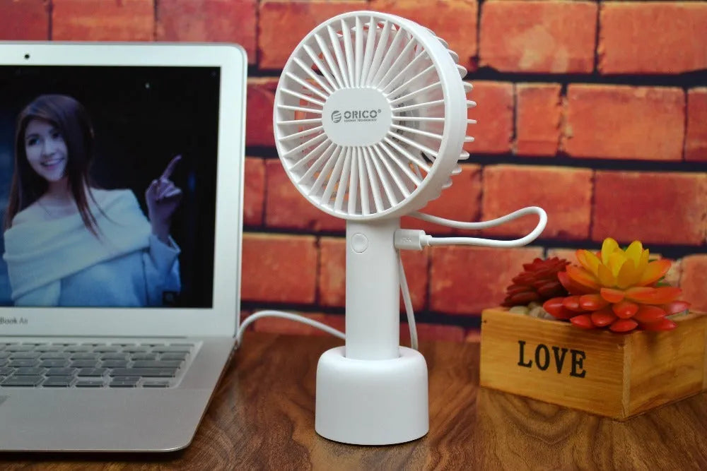 White ORICO FH1 USB rechargeable portable handheld and desktop fan with fine-line detailing.