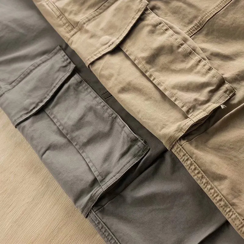 Men's khaki cotton trousers with multiple pockets and a cropped ankle length.