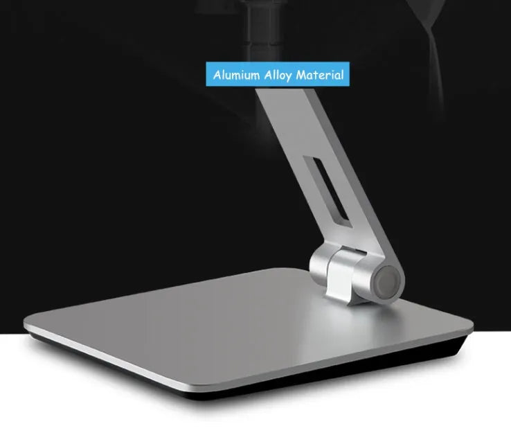 Black folding phone tablet holder with 360° rotating head on desktop