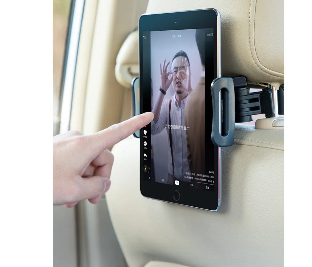 Black universal car phone holder attached to vehicle rear seat base with tablet mounted