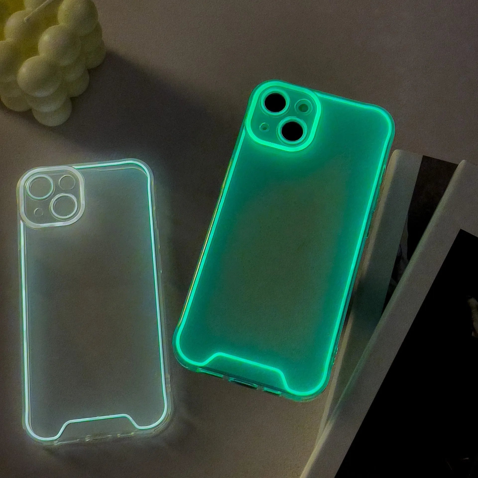 Glow in the dark Christmas soft shell phone case for iPhone in green, orange, blue, yellow, or pink.