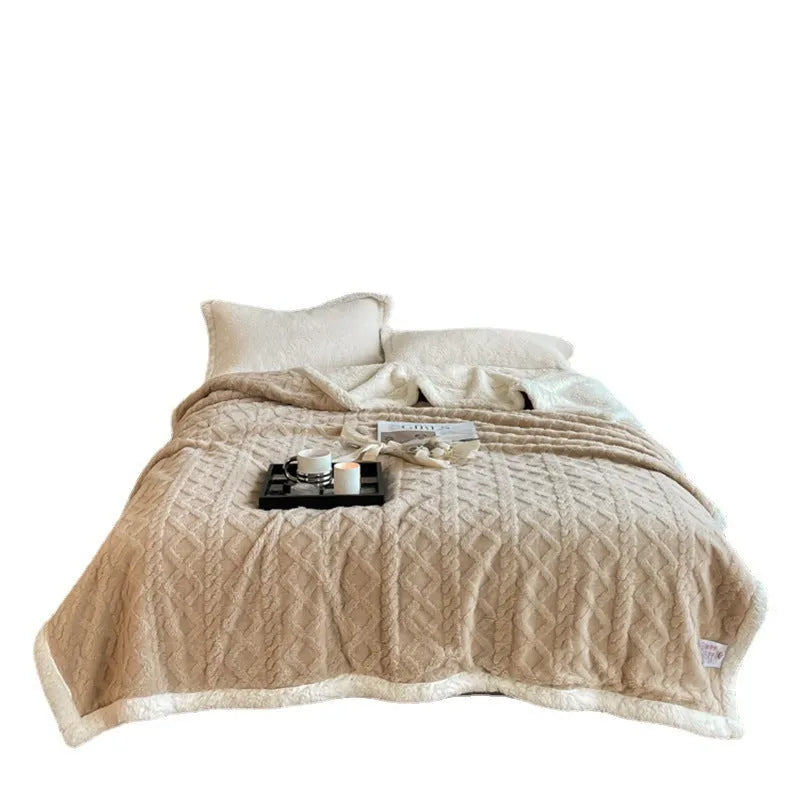 Polyester thermal flannel blanket in beige colour, folded to show texture, for winter bed use.