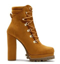 Women's suede high heel boots with round toe, thick heel, and Roman-style rivet and buckle details