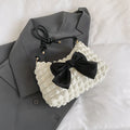 Women's canvas shoulder bag in horizontal square design with single strap and sandwich pockets
