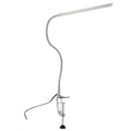Silver long arm LED clip table lamp with USB cable, shown illuminating a nail art workspace.