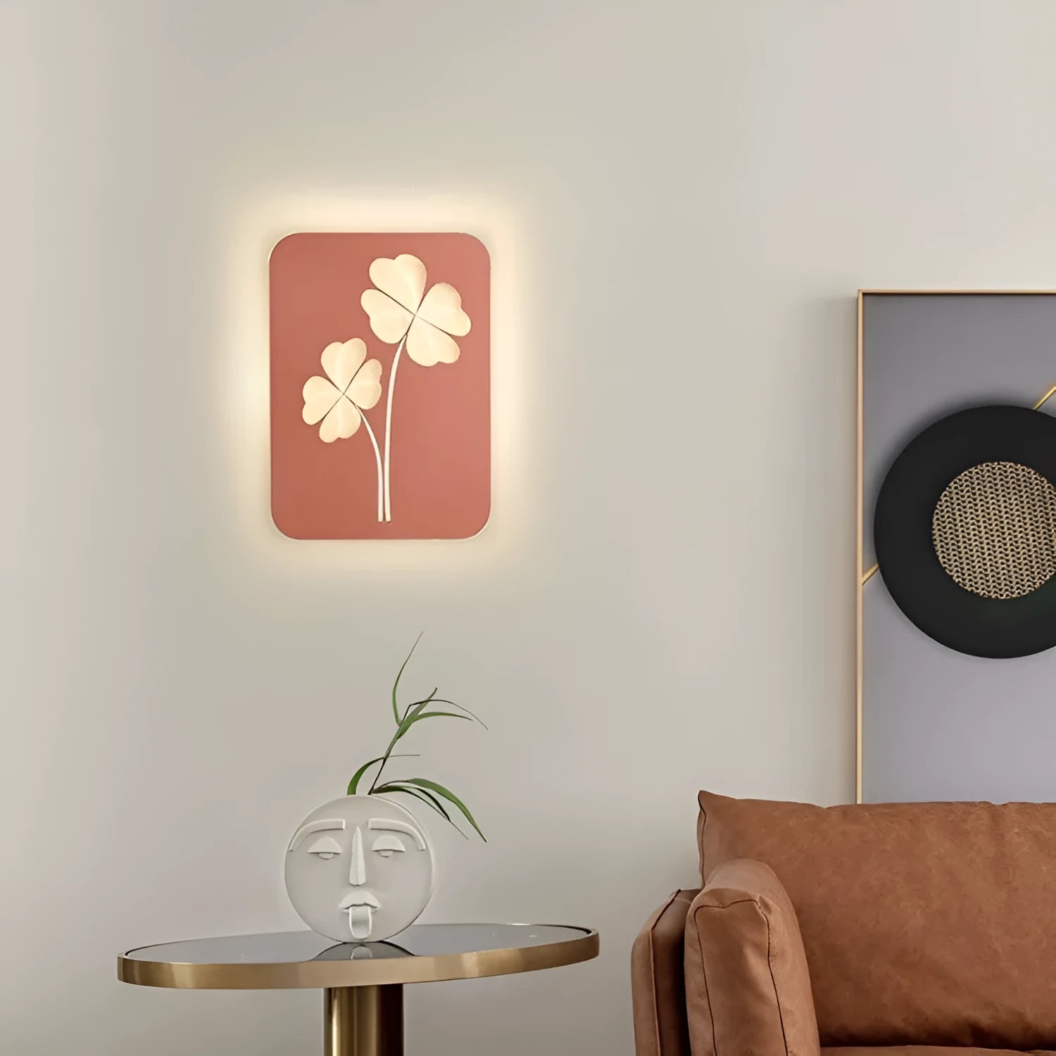 Modern cream coloured bedside lamp with acrylic shade and iron base on a wooden table.