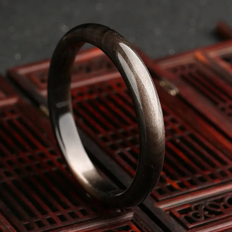 Natural silver stone cat's eye bracelet with geometric patterns on an alloy band.