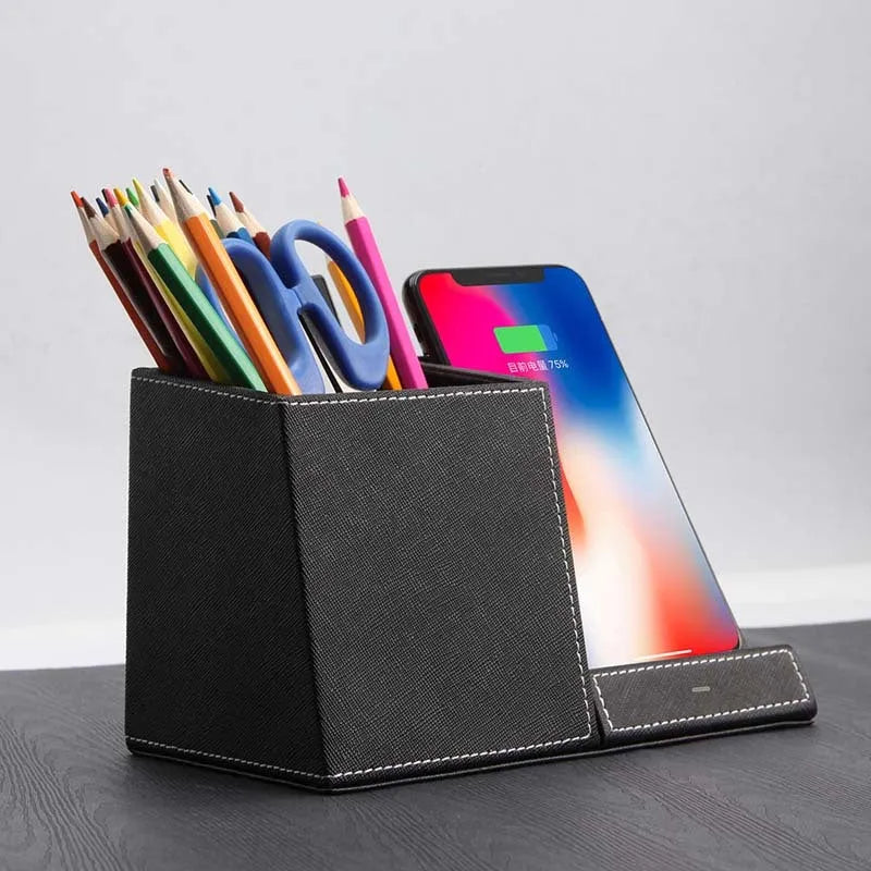 Black leather desk organiser with wireless phone charging surface and pen holder compartment