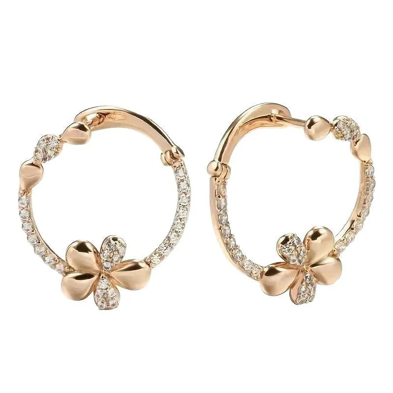 A pair of geometric round ring earrings for women in an electroplated copper finish.
