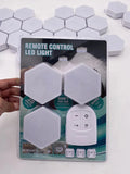 White wireless remote control touch light with 6 LED patches showing compact design