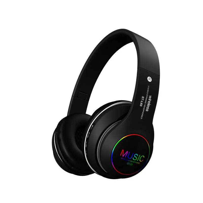 Black Bluetooth over-ear headset with microphone, showing USB charging port and 3.5mm jack